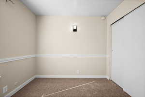 Unfurnished room with carpet floors