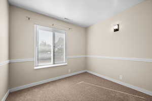 View of carpeted spare room