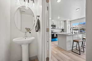 Bathroom featuring light wood-style floors and recessed lighting