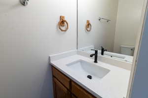 Bathroom with vanity and toilet