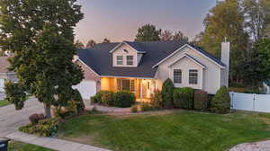 View of front of house with a lawn