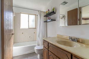 This full bathroom with vanity, shower / bath combination has entry from the Primary Bedroom and hallway.