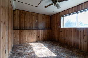 This roomy bedroom is streaming with natural light from the above, ground window to the back yard.