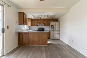 The kitchen features a breakfast bar and an open area for cooking and socializing.