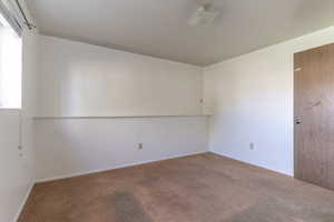 The front basement bedroom is bright and happy, enjoying natural light from the window that faces the front yard.