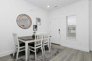 Dining room with light hardwood / wood-style floors