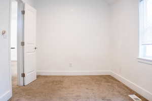 View of carpeted spare room