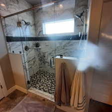 Bathroom featuring walk in shower