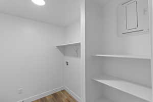 Laundry room featuring hardwood / wood-style floors and washer hookup