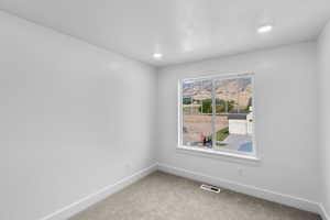 *Photo is of a previously built home of the same layout* View of carpeted spare bedroom