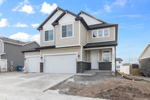 View of front of home with a 3 car garage *LANDSCAPING WILL BE INSTALLED IN SPRING*