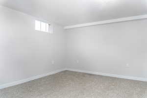 View of carpeted spare room