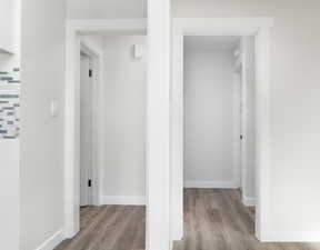 Corridor with light wood-type flooring