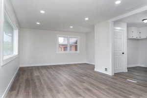 Empty room with hardwood / wood-style floors