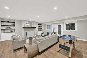 Living room with light hardwood / wood-style floors