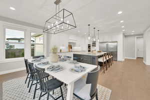 Dining space featuring light hardwood / wood-style floors