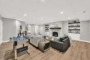 Living room with light hardwood / wood-style flooring