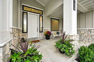 Entrance to property featuring a porch