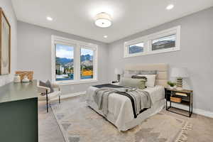 Carpeted bedroom with a mountain view