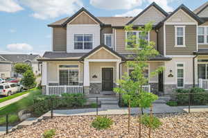 Craftsman house featuring covered porch and central AC unit