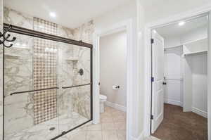 Beautifully upgraded Primary En Suite.  Designer oversized walk in shower with glass enclosure.  Separate toilet room.