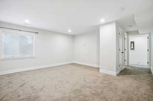 Basement family room, could be used as 4th Bedroom.  Has egress window with partial above ground views