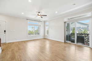 Living room with view of private balcony.  Bonus sliding glass doors and extra windows for END UNIT