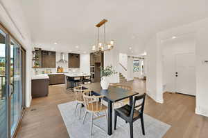 Dining area featuring a barn door and light hardwood / wood-style flooring