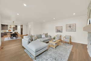 Living room with light hardwood / wood-style floors