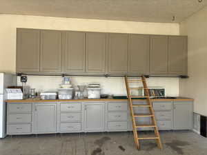 Attached Garage with custom cabinets