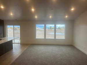 Interior space with sink, light hardwood / wood-style flooring, and plenty of natural light