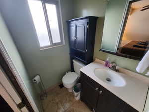 Bathroom featuring toilet and vanity