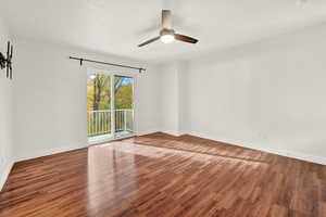 Spare room featuring hardwood / wood-style floors and ceiling fan