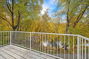 Wooden deck featuring a water view