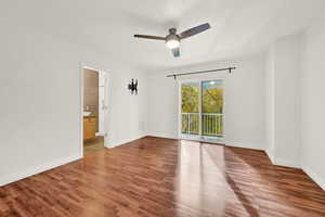 Empty room featuring ceiling fan and wood-type flooring