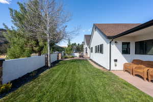 View of yard with a patio