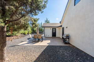 View of patio featuring a grill