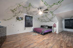 Bedroom featuring dark wood-type flooring and ceiling fan