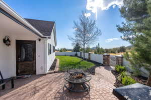 View of patio / terrace with a fire pit