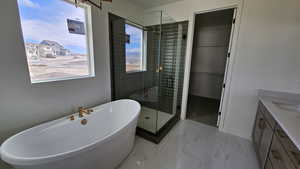 Bathroom with vanity and plus walk in shower