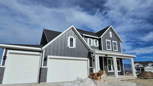 View of front of home featuring a garage