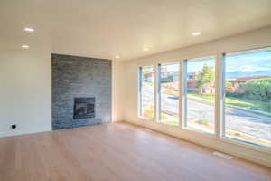 Unfurnished living room with light hardwood / wood-style floors