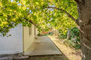 View of side of property with a patio