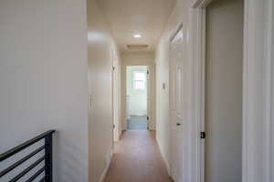 Hallway featuring light hardwood / wood-style floors