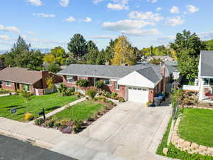 Single story home with a front lawn and a garage