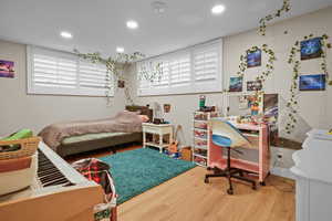 Bedroom with wood-type flooring