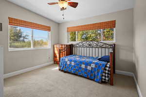 Bedroom with ceiling fan and carpet flooring