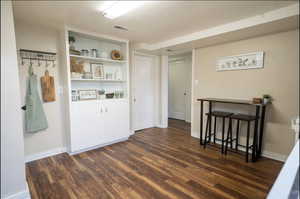 Interior space featuring dark hardwood / wood-style flooring