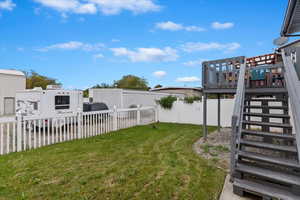 View of yard featuring a deck