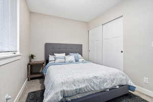 Bedroom with a closet and carpet floors